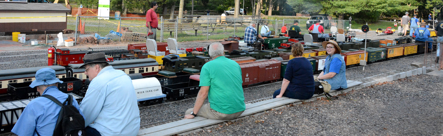 photo of members and guests watching trains